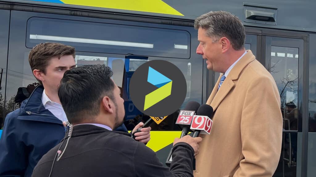 News interview happening at the EMBARK RAPID bus line launch.